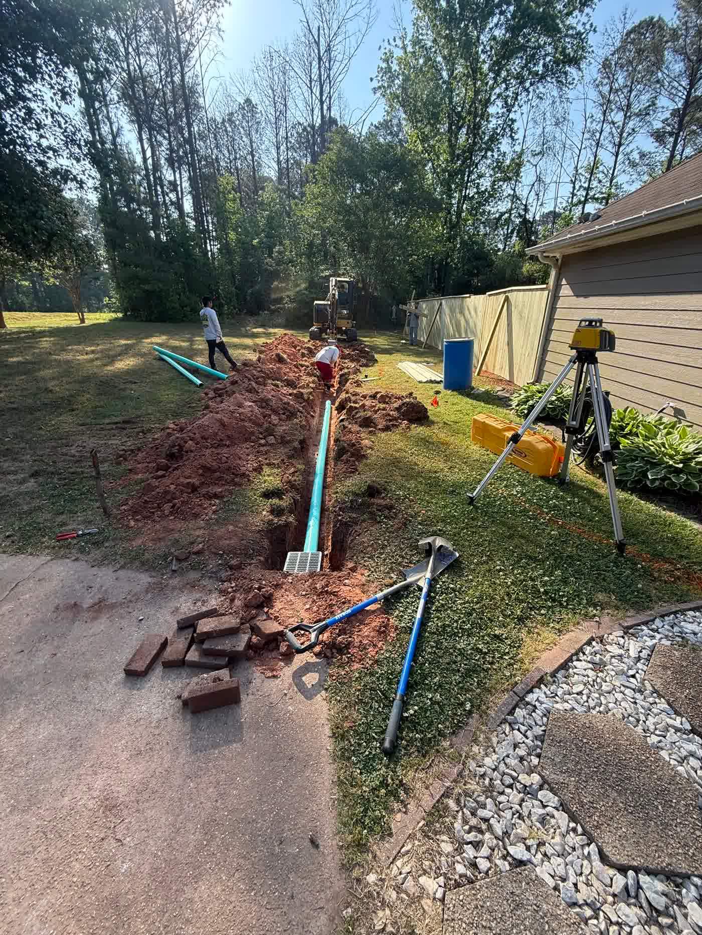 Drain lines laid out across a back yard