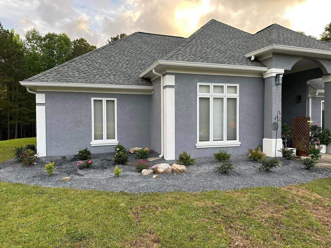 Finished stucco home with new foundation landscaping