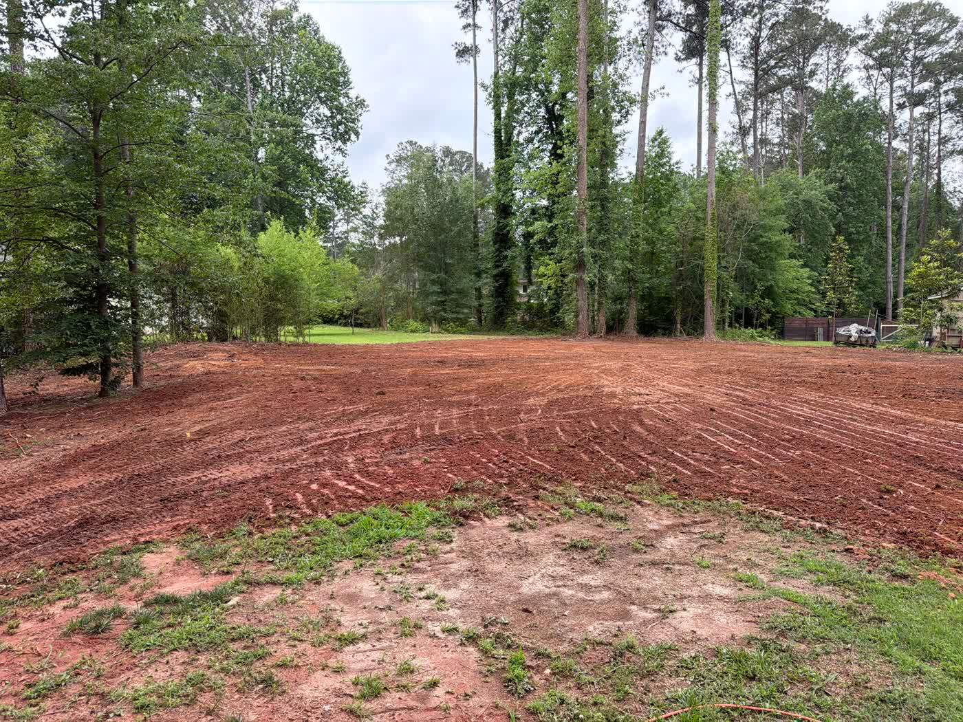 Finished graded red clay pad ready for construction