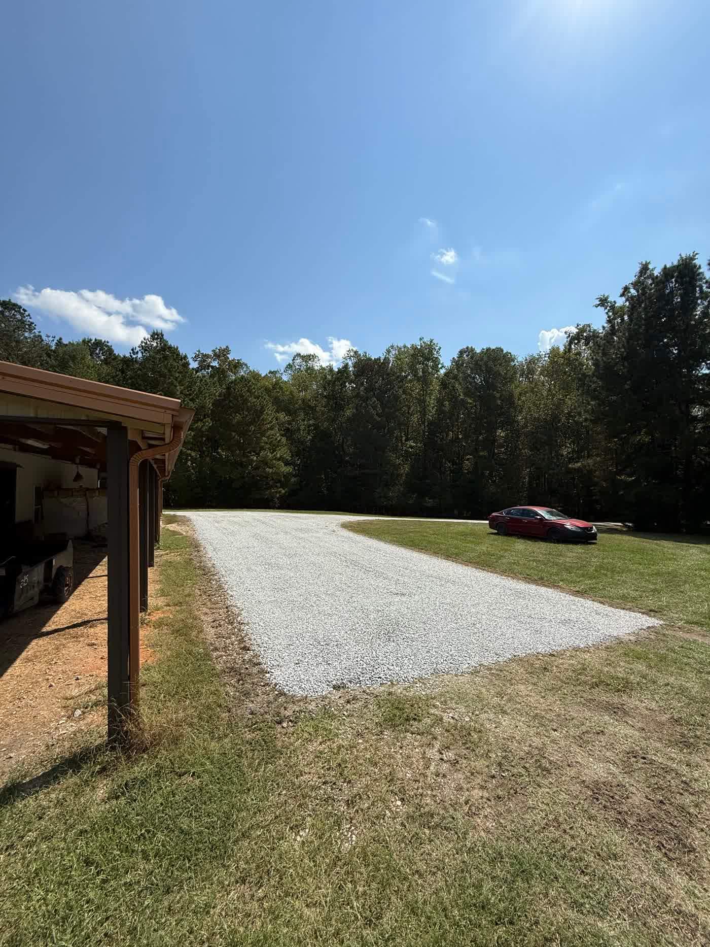 Compacted gravel pad set under an open pavilion