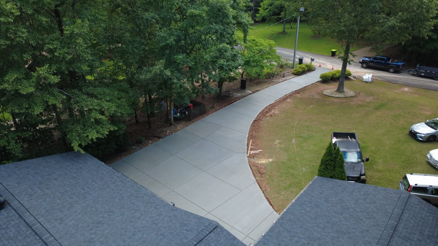 Aerial view of a poured concrete drive beside a home