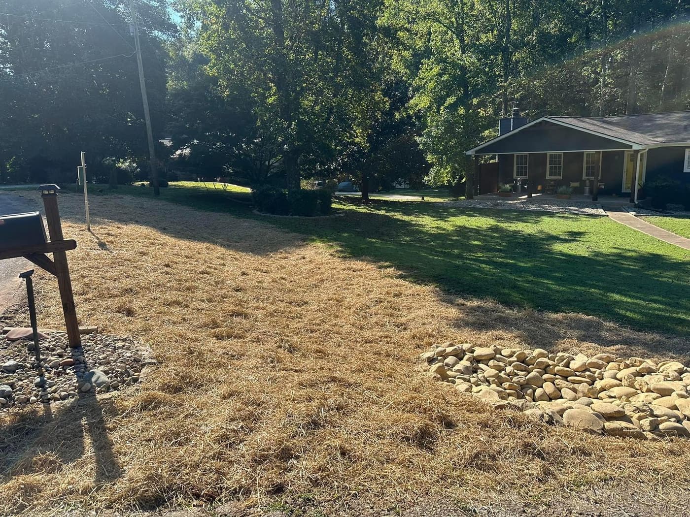 Wide rock channel across a graded yard
