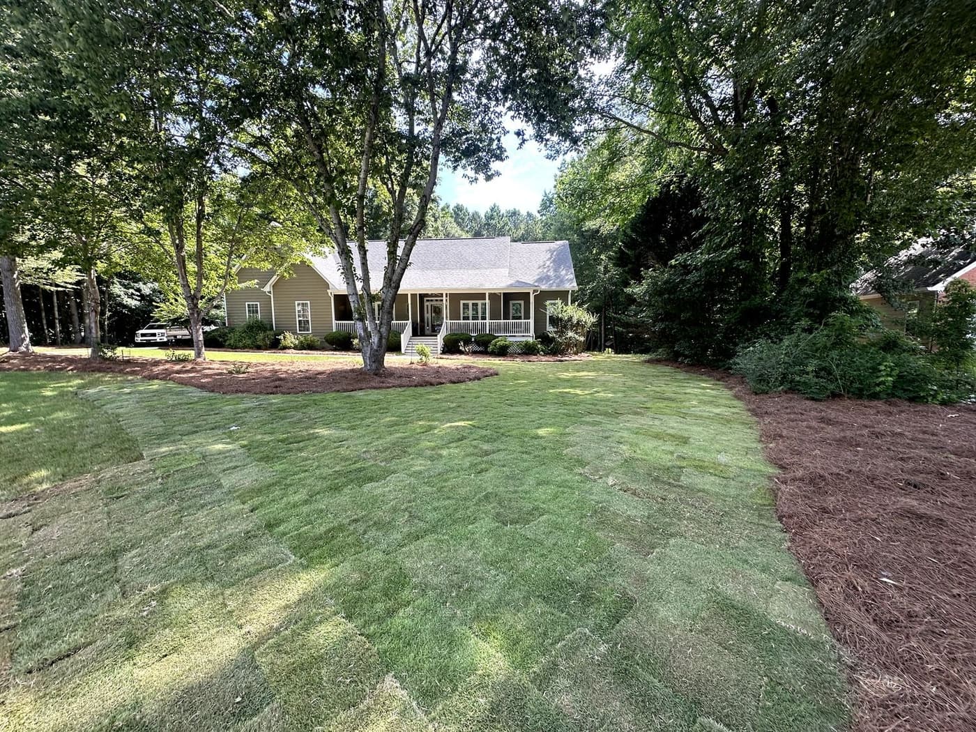 Wide finished sod lawn behind a home
