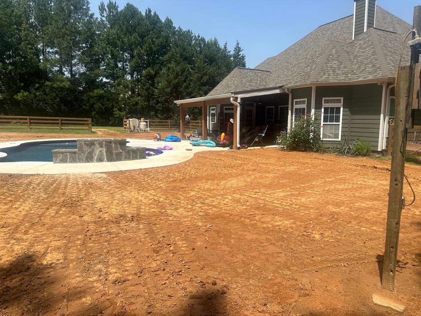 Machines grading a large site in the Fayetteville area